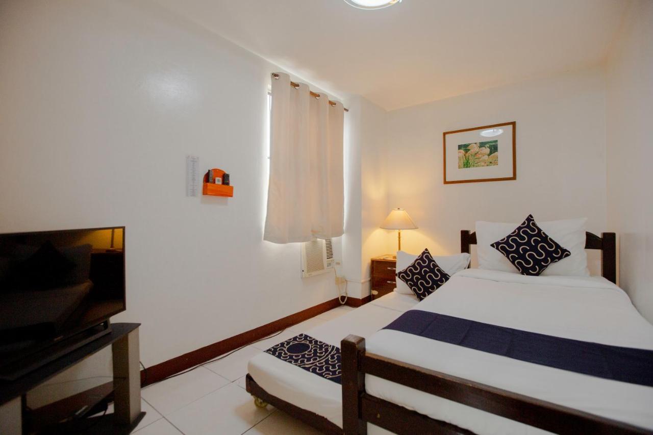 Capital O 201 Newgrange Condotel Cidade Quezon Exterior foto